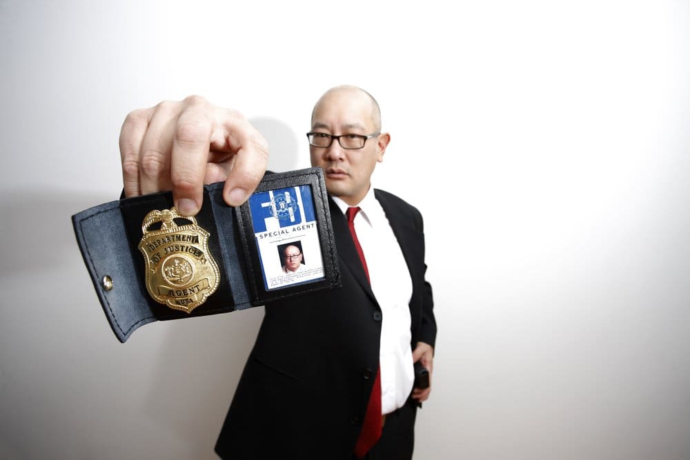 FBI agent holding badge