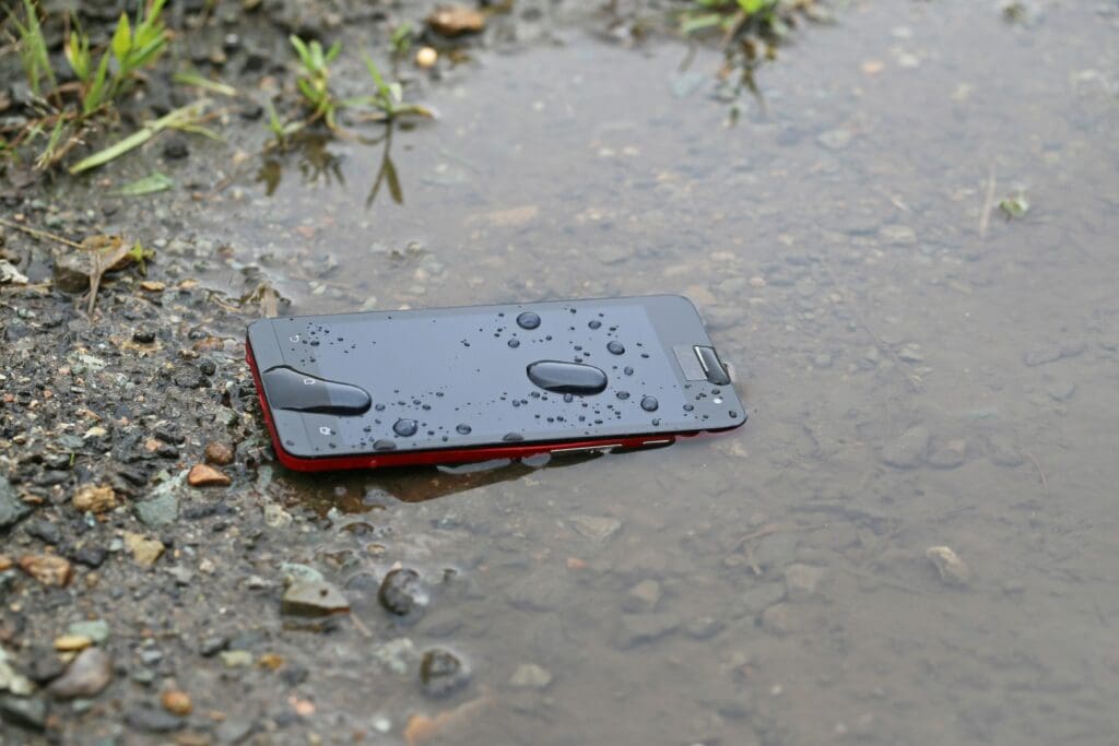 Cell phone in a puddle of water