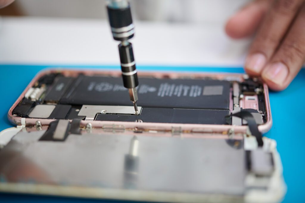 phone repairs workstation with tools for iPhone repair and battery service