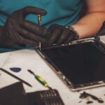 Technician performing iPad screen repair at Repair Express in Kelowna